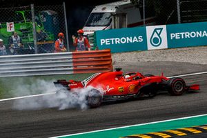 Sebastian Vettel, Ferrari SF71H lighting up his tyres after making contact with Lewis Hamilton, Mercedes AMG F1 W09 