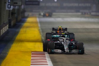 Valtteri Bottas, Mercedes AMG W10, leads Alexander Albon, Red Bull Racing RB15