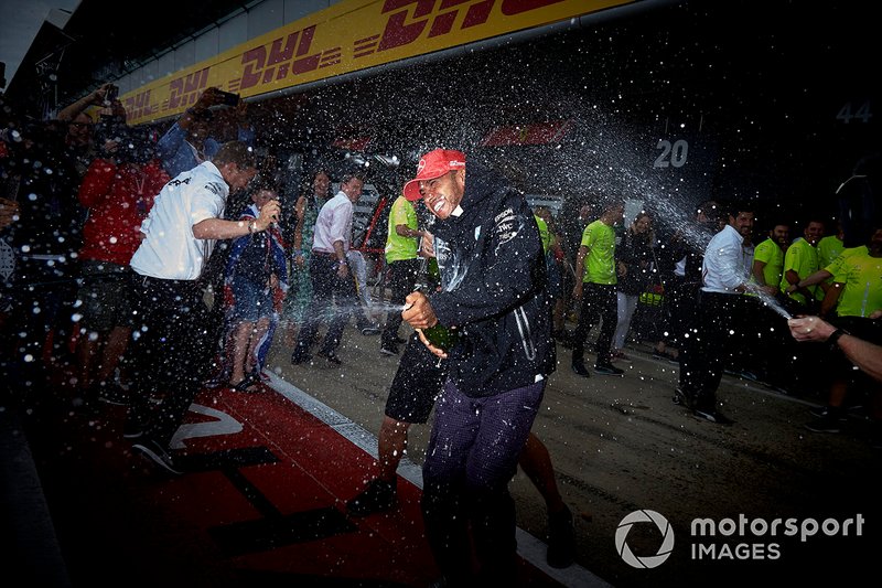 Mercedes team members blast Lewis Hamilton, Mercedes AMG F1, 1st position, with Champagne
