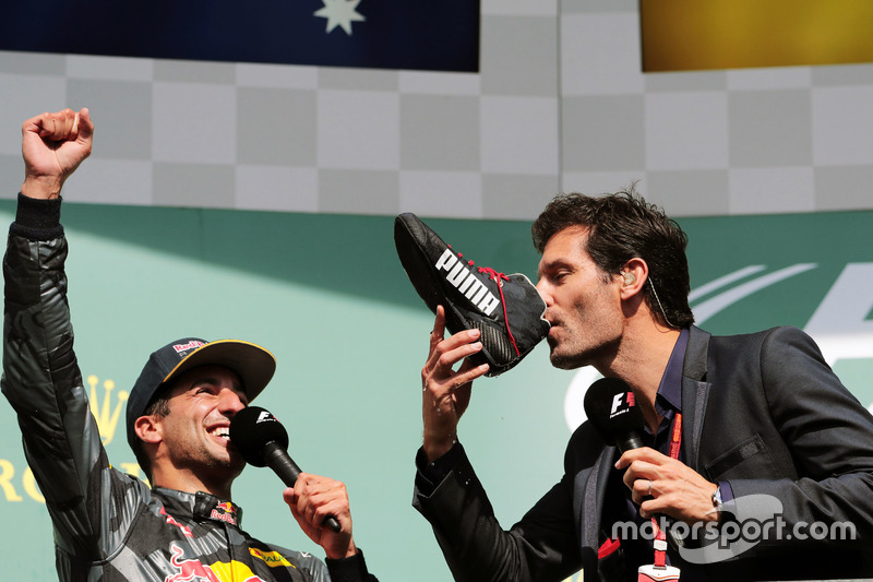 (L to R): Daniel Ricciardo, Red Bull Racing celebrates his second position on the podium with Mark W