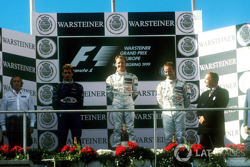 Podium: race winner Johnny Herbert, Stewart-Ford SF-3, second place Jarno Trulli, Prost Peugeot AP02