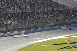 Joey Logano, Team Penske, Ford Mustang Discount Tire takes the checkered flag ahead of Justin Allgai