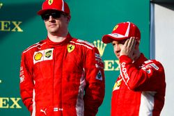 Kimi Raikkonen, Ferrari, and Sebastian Vettel, Ferrari, celebrate on the podium