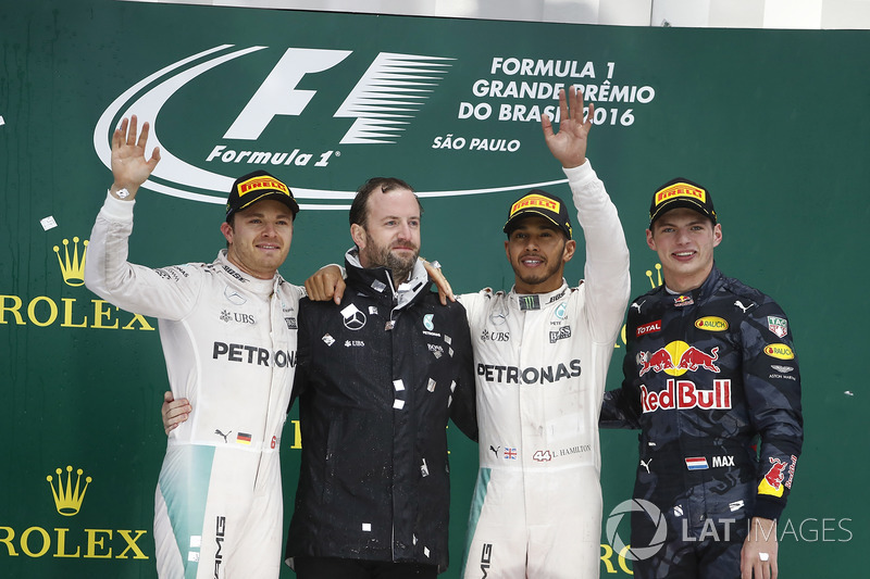 Nico Rosberg, Mercedes AMG, 2nd Position, Bradley Lord, Communication Manager, Mercedes AMG F1,Lewis Hamilton, Mercedes AMG, 1st Position, and Max Verstappen, Red Bull Racing, 3rd Position, on the podium