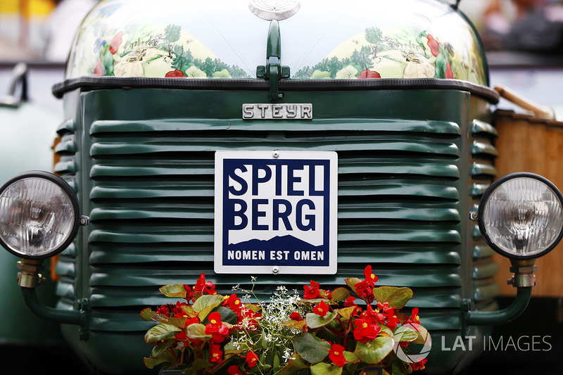 A tractor decked in flowers in the Red Bull Ring paddock