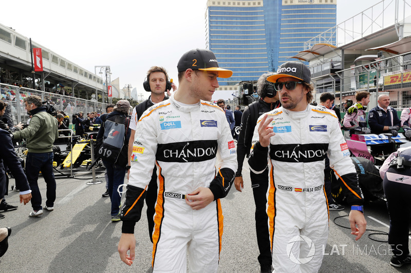 Stoffel Vandoorne, McLaren, and Fernando Alonso, McLaren, on the grid