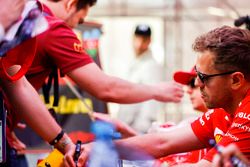 Sebastian Vettel, Ferrari, signs an autograph