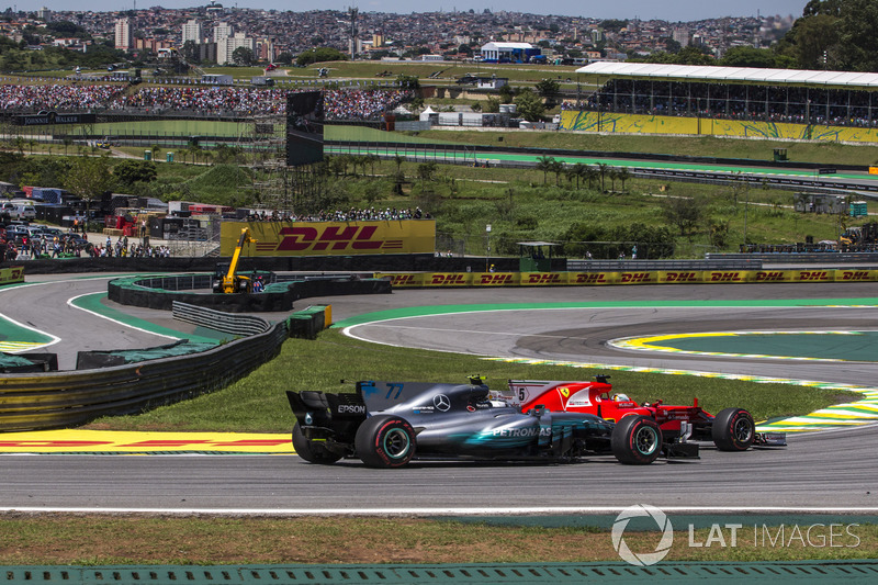 Sebastian Vettel, Ferrari SF70H and Valtteri Bottas, Mercedes-Benz F1 W08 battle for position