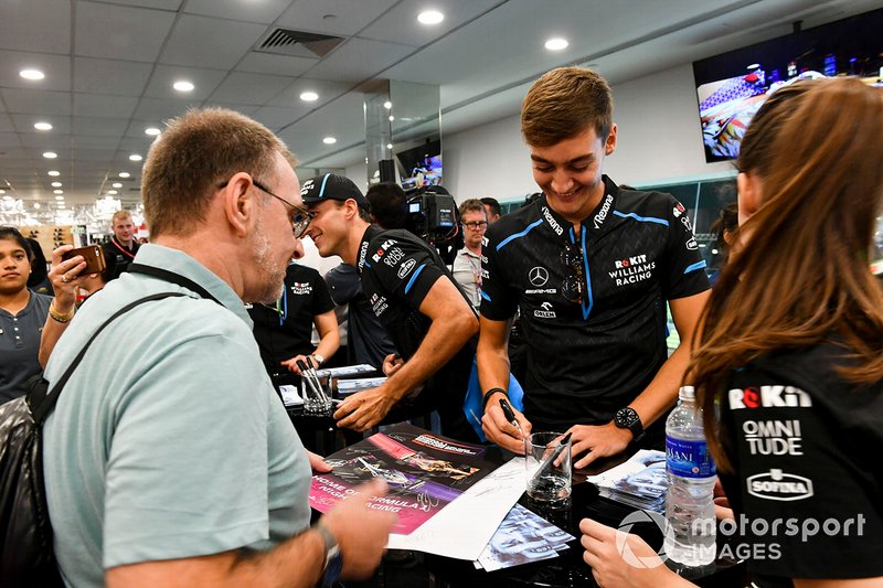 George Russell, Williams Racing signs an autograph for a fan