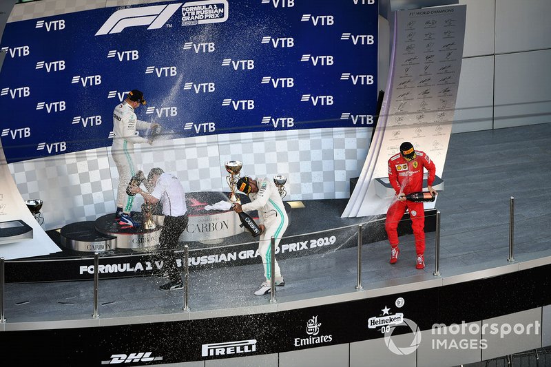 Fred Judd, Chief Engineer Trackside, Mercedes AMG F1, Valtteri Bottas, Mercedes AMG F1, 2nd position, Lewis Hamilton, Mercedes AMG F1, 1st position, and Charles Leclerc, Ferrari, 3rd position, celebrate on the podium