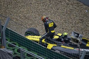 Nico Hulkenberg, Renault F1 Team, climbs out of his damaged car and retires from the race