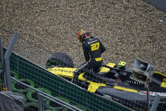 Nico Hulkenberg, Renault F1 Team, climbs out of his damaged car and retires from the race