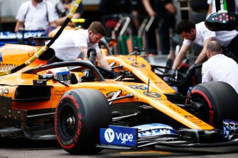 Carlos Sainz Jr., McLaren MCL34, and Lando Norris, McLaren MCL34, in the pit lane