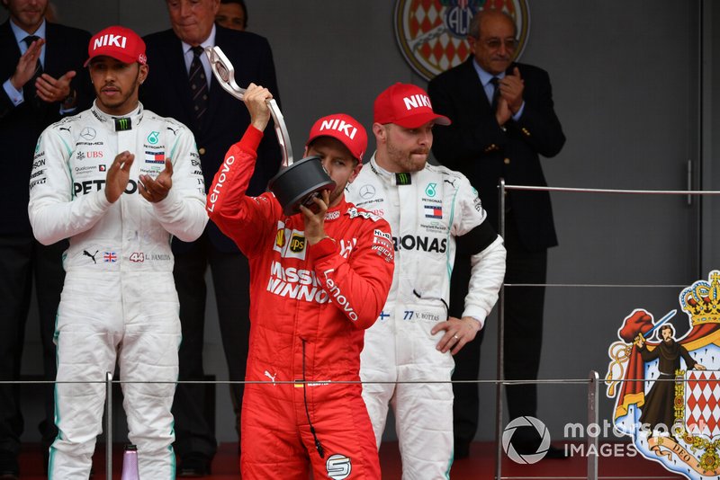 Sebastian Vettel, Ferrari, 2nd position, kisses his trophy
