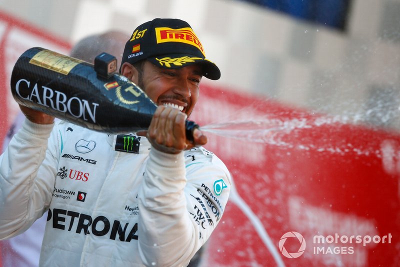 Lewis Hamilton, Mercedes AMG F1, 1st position, sprays Champagne on the podium