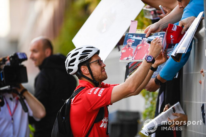 Sebastian Vettel, Ferrari, signs autographs for fans