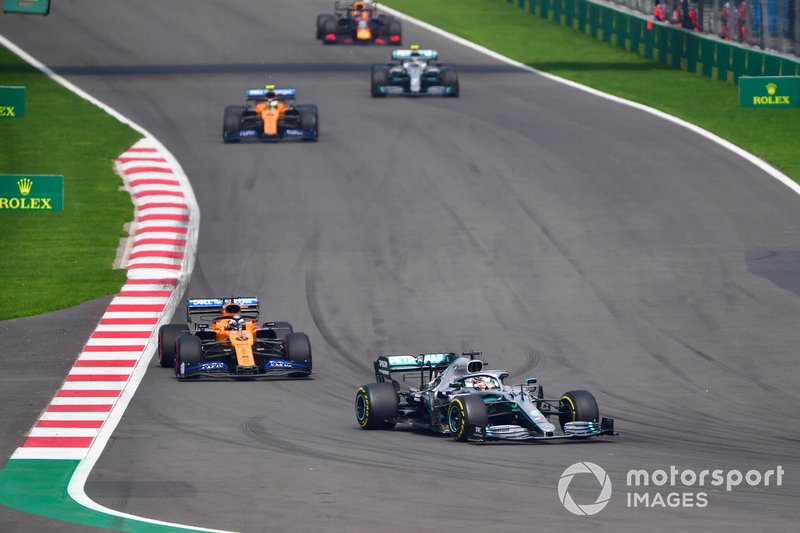Lewis Hamilton, Mercedes AMG F1 W10, leads Carlos Sainz Jr., McLaren MCL34, Lando Norris, McLaren MCL34, and Valtteri Bottas, Mercedes AMG W10