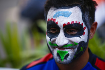 A Toro Rosso mechanic sports a painted face