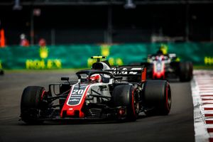 Kevin Magnussen, Haas F1 Team VF-18, leads Romain Grosjean, Haas F1 Team VF-18