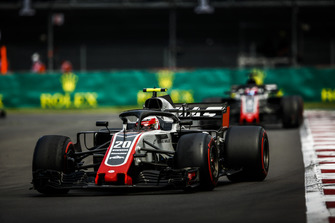 Kevin Magnussen, Haas F1 Team VF-18, leads Romain Grosjean, Haas F1 Team VF-18