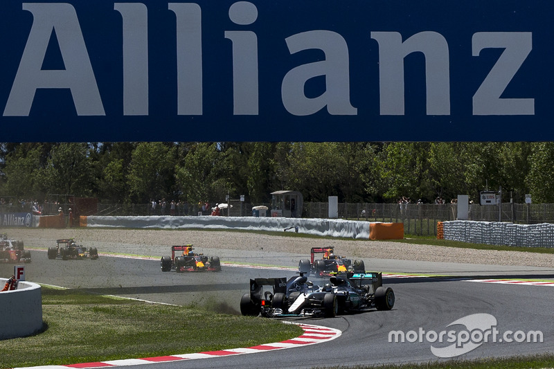 Lewis Hamilton, Mercedes AMG F1 W07 Hybrid and Nico Rosberg, Mercedes AMG F1 W07 Hybrid collide on the opening lap of the race