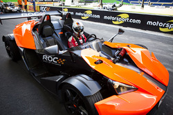 Sebastian Vettel sits in the KTM X-Bow Comp R