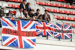 Fans of Lewis Hamilton, Mercedes AMG F1 W08, display banners of support
