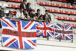 Fans of Lewis Hamilton, Mercedes AMG F1 W08, display banners of support