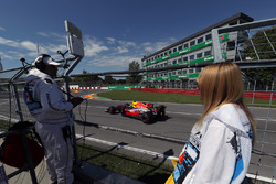 Marshals observe Max Verstappen, Red Bull Racing RB13
