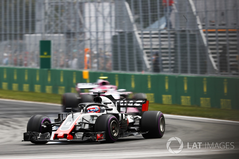 Romain Grosjean, Haas F1 Team VF-18, leads Esteban Ocon, Force India VJM11