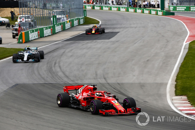 Sebastian Vettel, Ferrari SF71H, leads Valtteri Bottas, Mercedes AMG F1 W09, and Max Verstappen, Red Bull Racing RB14