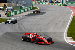 Sebastian Vettel, Ferrari SF71H, leads Valtteri Bottas, Mercedes AMG F1 W09, and Max Verstappen, Red
