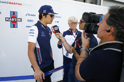 Lance Stroll, Williams Racing, talks to the media