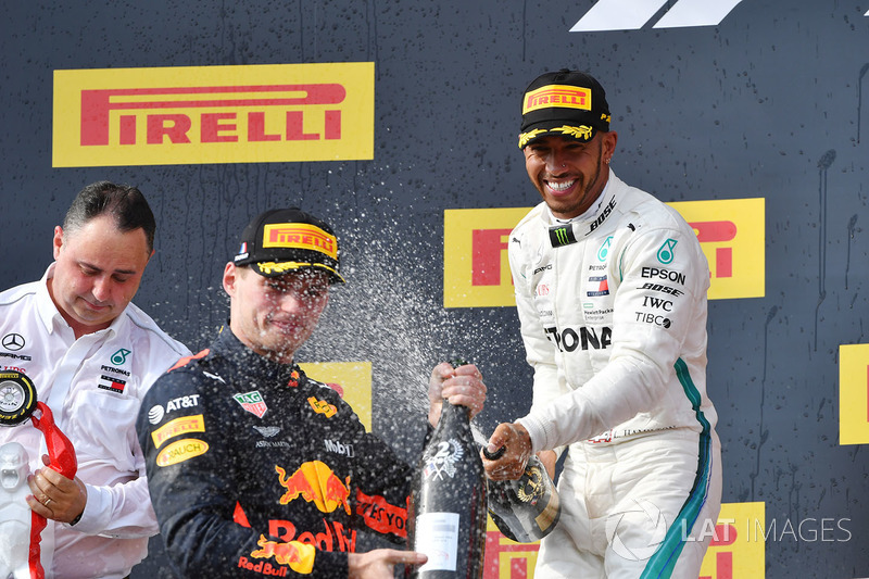 Max Verstappen, Red Bull Racing and Lewis Hamilton, Mercedes-AMG F1 celebrate on the podium with the champagne