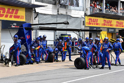 Scuderia Toro Rosso mechanics await a pit stop