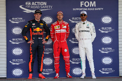 Pole winner Sebastian Vettel, Ferrari, talks to sceond place Max Verstappen, Red Bull Racing, third