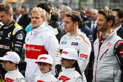 Nico Hulkenberg, Renault Sport F1 Team, Marcus Ericsson, Sauber, Charles Leclerc, Sauber, and Romain Grosjean, Haas F1 Team, on the grid for the national anthem