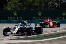 Valtteri Bottas, Mercedes AMG F1 W09, leads Sebastian Vettel, Ferrari SF71H