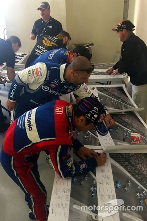 Drivers sign Justin Wilson poster