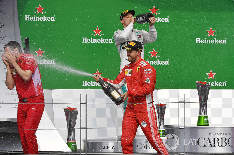 Race winner Sebastian Vettel, Ferrari celebrates on the podium with the chmpagne
