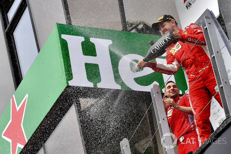 Race winner Sebastian Vettel, Ferrari celebrates with the champagne on the podium