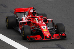 Sebastian Vettel, Ferrari SF71H, punches the air at the finish, after taking victory