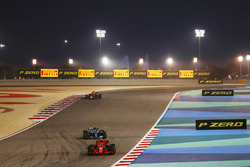 Kimi Raikkonen, Ferrari SF71H, leads Valtteri Bottas, Mercedes AMG F1 W09