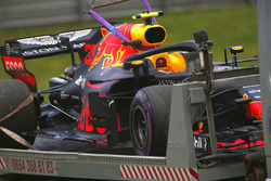 The Max Verstappen Red Bull Racing RB14 is returned to the pits on the back of a truck