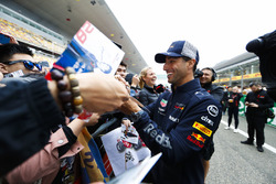 Daniel Ricciardo, Red Bull Racing, signs autographs for fans