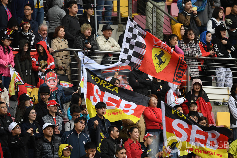 Sebastian Vettel, Ferrari fans and flags