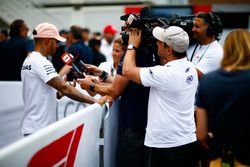 A Fox cameraman films Lewis Hamilton, Mercedes AMG F1