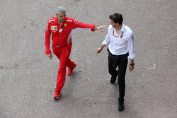 Maurizio Arrivabene, Team Principal, Ferrari, with Toto Wolff, Executive Director (Business), Mercedes AMG
