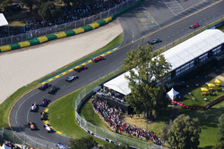 Sebastian Vettel, Ferrari SF70H, leads Valtteri Bottas, Mercedes AMG F1 W08, Kimi Raikkonen, Ferrari SF70H, Felipe Massa, Williams FW40, and the remainder of the field