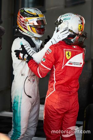 Sebastian Vettel, Ferrari, 1st Position, and Lewis Hamilton, Mercedes AMG, 2nd Position, congratulate each other in Parc Ferme